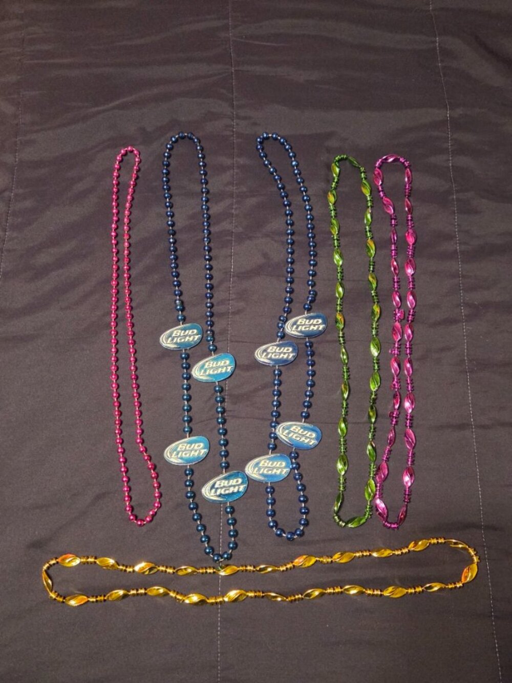 VARIOUS COLORFUL PLASTIC MARDI GRAS BEADED NECKLACES